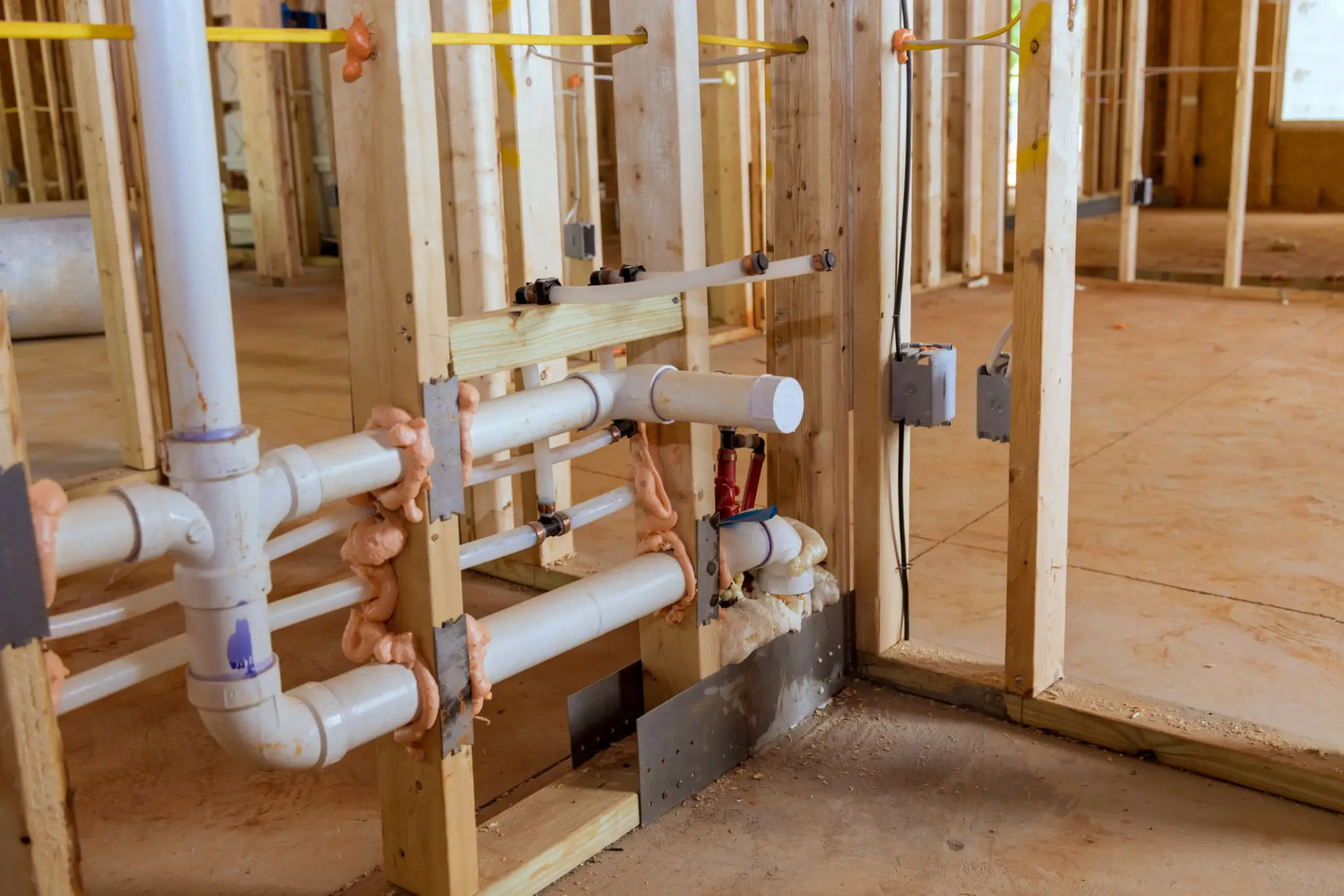 Plumbing system installed in a building under construction.