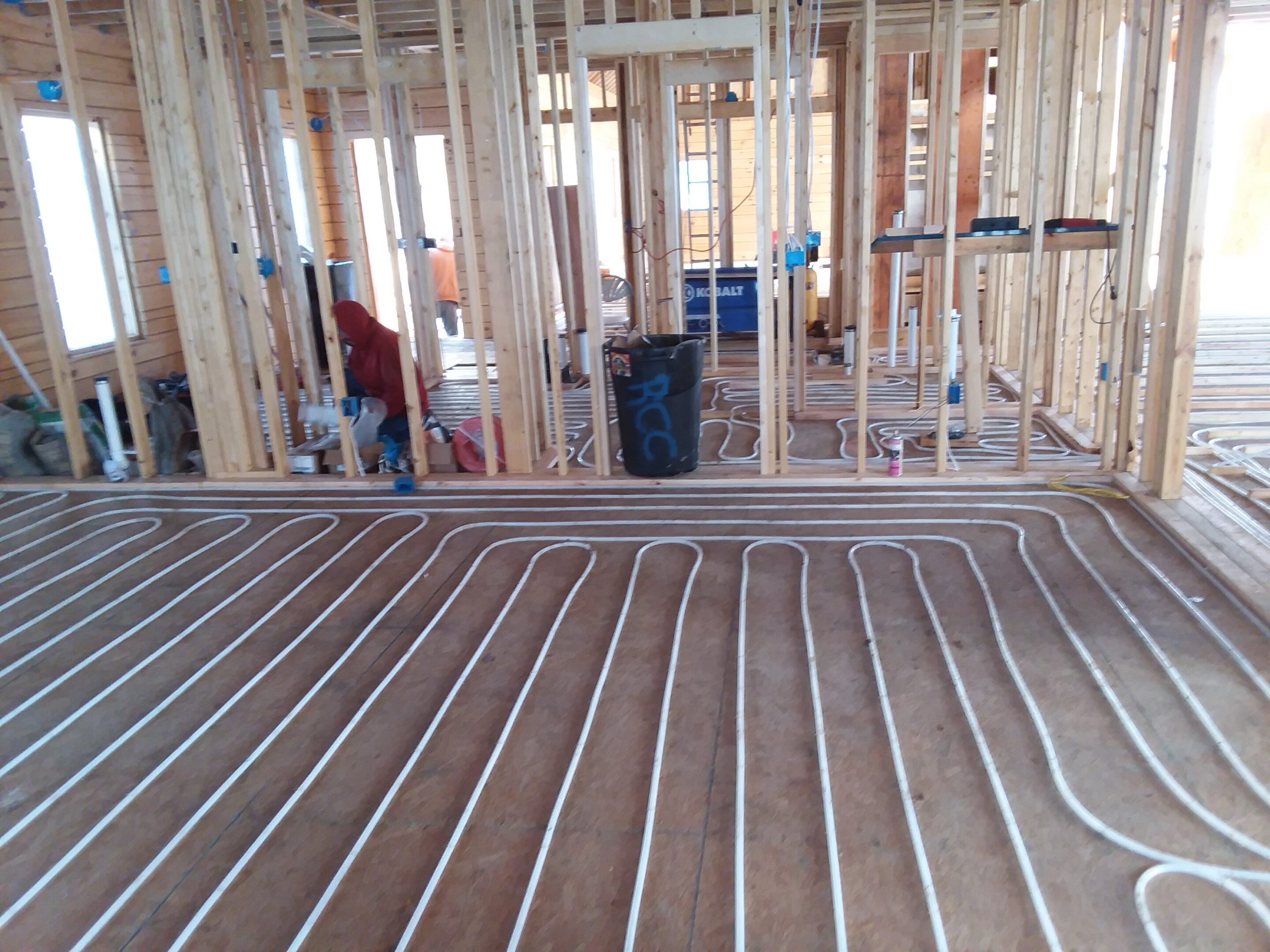 Radiant floor heating pipes installed in a building under construction.